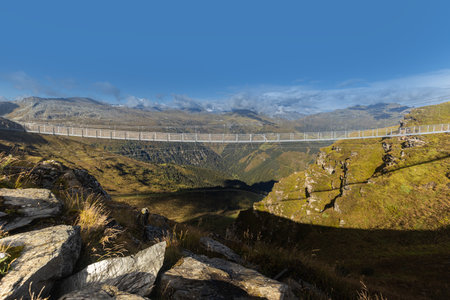 Alpine suspension metal bridge over a precipice at an altitude of 2200 meters in the Alps. Austria, Salzburg, Gasteinの写真素材