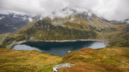 Alpine lake with clean clear water in the bowl of the Alpine mountains. Austria, Salzburg, Gastein Valleyの写真素材