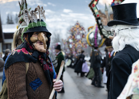 AUSTRIA, GASTEIN - January 1, 2023: Conversation of the participants in the procession of Perchtsのeditorial素材