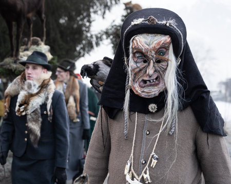 AUSTRIA, GASTEIN - January 1, 2023: old witch in the perchtenlauf procession in the austrian Gastein valleyのeditorial素材