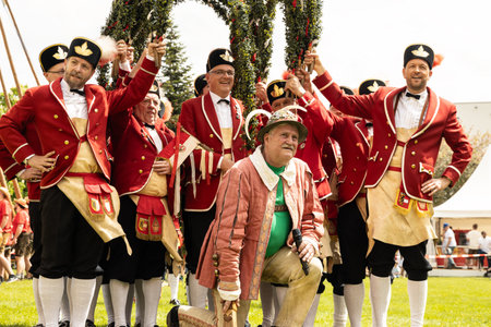 AUSTRIA, SALZBURG - 7 MAI, 2023: Elder and dancers at the maypole ceremony in Stiegl