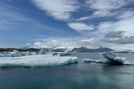 Icebergs Floating in Jokulsarlon Lagoon on a Sunny Dayの写真素材