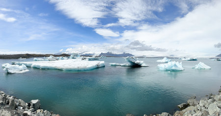 Icebergs Floating in Jokulsarlon Glacial Lagoon on a Sunny Dayの写真素材
