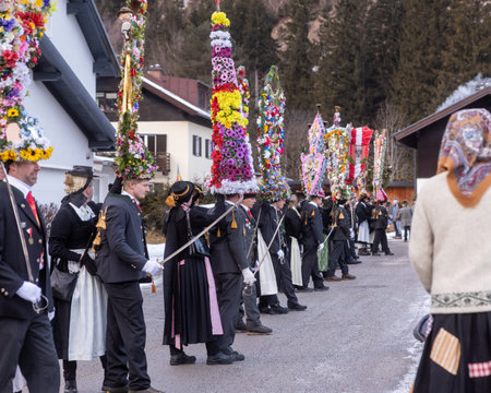 AUSTRIA, SALZBURGER LAND, BAD GASTEIN - JANUARY 1, 2026: Traditional festival participants with...