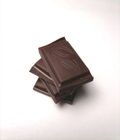 Pieces of chocolate on white backgroundの写真素材