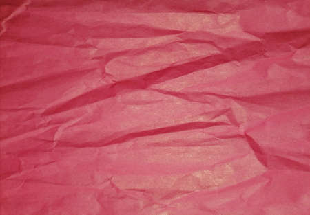 Red crumpled paper backgroundの写真素材
