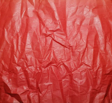 Red crumpled paper backgroundの写真素材