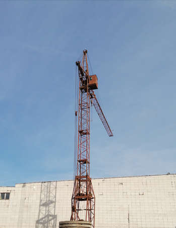 Crane high against the blue skyの写真素材