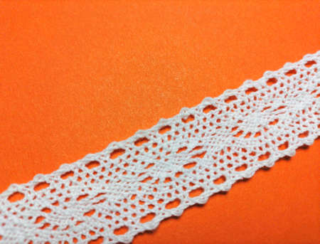 Lace on an orange backgroundの写真素材