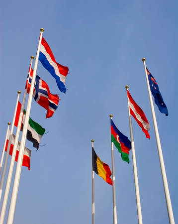 Different countries flags united together against blue skyの写真素材