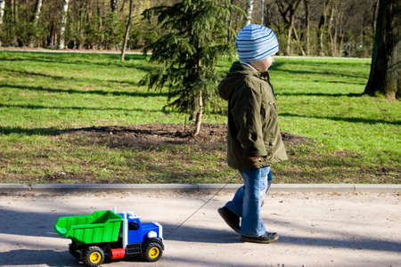 The little boy is playing with car.の写真素材
