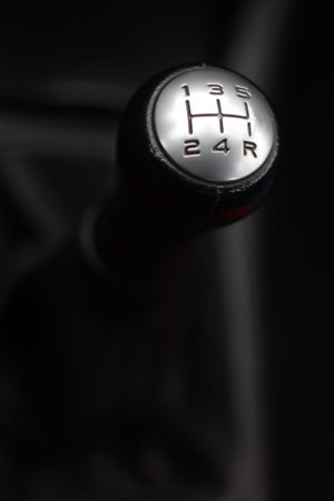 black gear lever with silver surface, five-speed gearbox