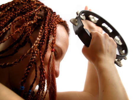 woman plays the tambourineの写真素材