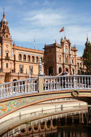 Woman on bridge at Plaza de Espana in Seville, Spain