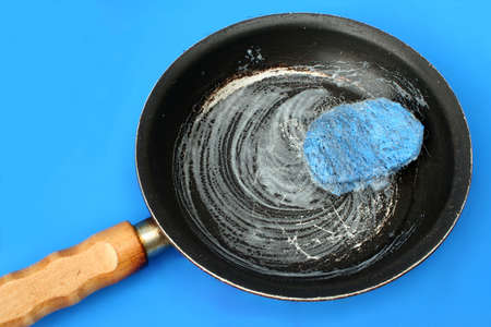 washing pots and pansの写真素材