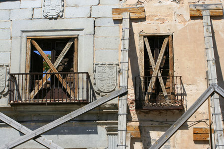 boarded up windows in abandoned buildingの写真素材