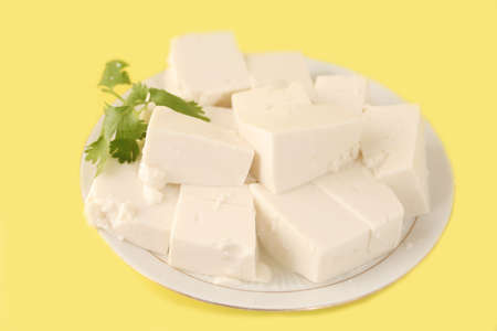 plateful of cut up vegetarian tofu (with clipping path so you'll be able to change background easily)の写真素材
