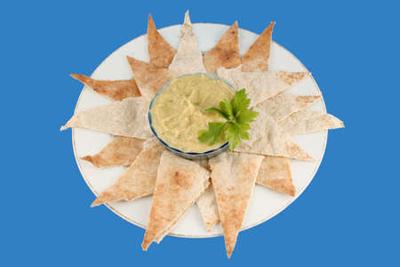 fresh hummus and cut up whole wheat pita bread (with clipping path)の写真素材