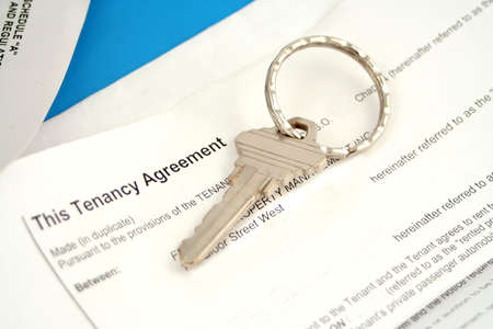 some paperwork concerning tenancy agreement with keyの写真素材