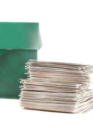 a green case full of collector's cards and stack