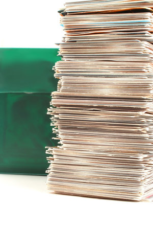 a green case full of collector's cards and stack
