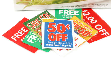 clipping coupons to save money at the grocery storeの写真素材