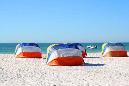 colorful shady canopies along the beach in Florida along the Gulf Coast in Clearwater Beachの写真素材
