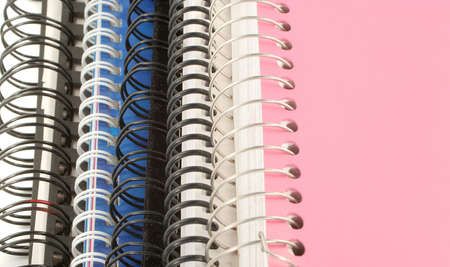 a pile of metal ring binder notebooksの写真素材