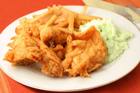 fried chicken, french fries with gravy and coleslaw dinnerの写真素材
