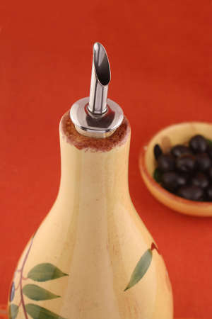 dishes with black olives  with oil bottle in the foregroundの写真素材