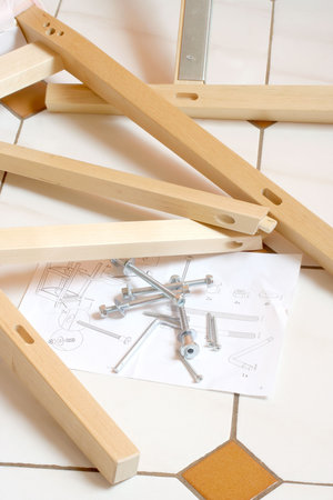 pieces of wood, screws and instructions for building furnitureの写真素材