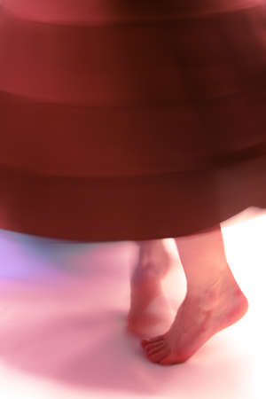 woman dances (focus on foot)の写真素材