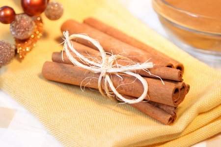 festive cinnamon sticks tied in a bough on a napkin