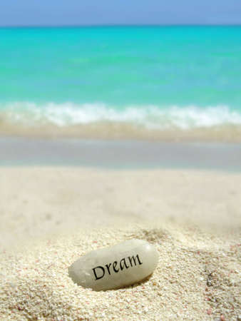 a dream stone on a sand mound on a tropical beach         の写真素材