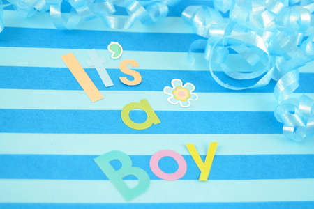  celebratory it's a boy text background with  ribbon suitable for new babyの写真素材