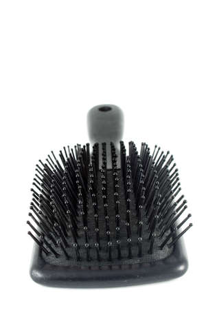 black flat hairbrush on a white backgroundの写真素材