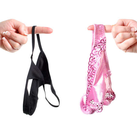 sexy  women's pink silk and black cotton thong undergarments or lingerie hanging off fingerの写真素材