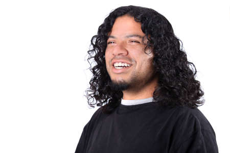 Multi-racial male with white teeth smile and long curly hair on a white backgroundの写真素材