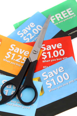 Cutting coupons in different colors, and price ranges from free to a few dollars (short depth of field)の写真素材