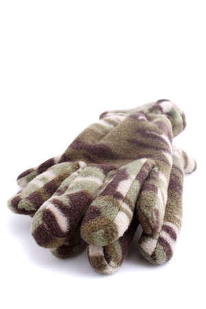 Warm camouflage style winter gloves on white background (not isolated)の写真素材