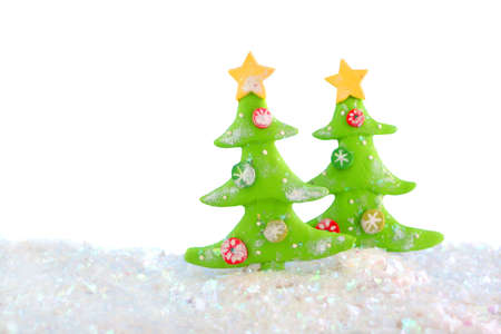 christmas tree clay ornaments scene with glittery fake snow の写真素材