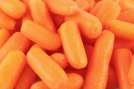 Fresh  and healthy organic baby carrots good for a food backgroundの写真素材