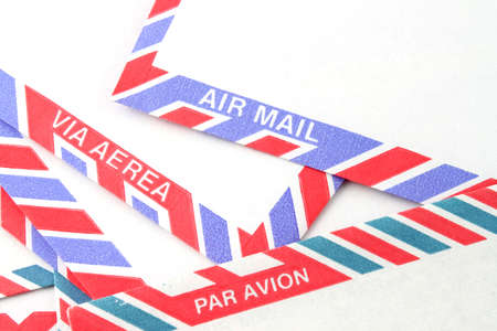 Close up of striped Air Mail envelopes  in different languages in red and blueの写真素材