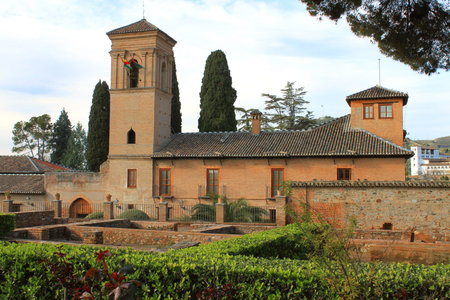 Granada - Spain, March 28, 2013: View of stone building and gardens of Alhambra, Granada, one of the...