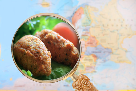 Looking in on word food showing Portuguese fish cakes a specialty with European map in the...