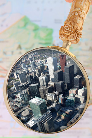 Looking in on Toronto, with blurred map of Ontario, Canada in the background