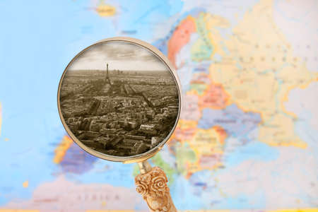 Looking in on the cityscape of Paris, Francis showing the Eiffel Tower with blurred map of Europe in the backgroundの写真素材