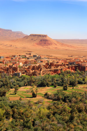 Moroccan  village on the Eastern slopes of the Atlas Mountains at Tinerhir oasisの写真素材