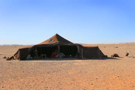 SAHARA DESERT, MOROCCO - MARCH 1, 2016: Family living in  a Berber tent in the Sahara Desert, Morocco, Africaのeditorial素材