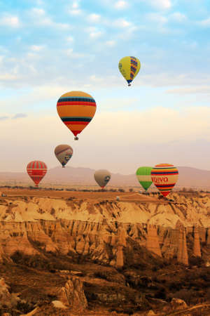CAPPACOCIA, TURKEY - FEB. 15, 2016: Hot air balloon  in the  early morning during sunrise over the rock formations of Cappadocia, Turkeyのeditorial素材